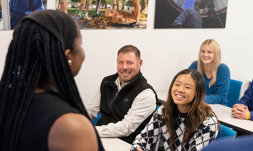 A group of Villanova students talking together during class
