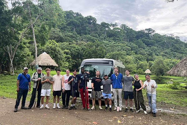 Students and faculty after completing a rural rainforest hike