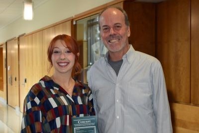 A Villanova student and faculty member at the official launch party of the Concept research journal.