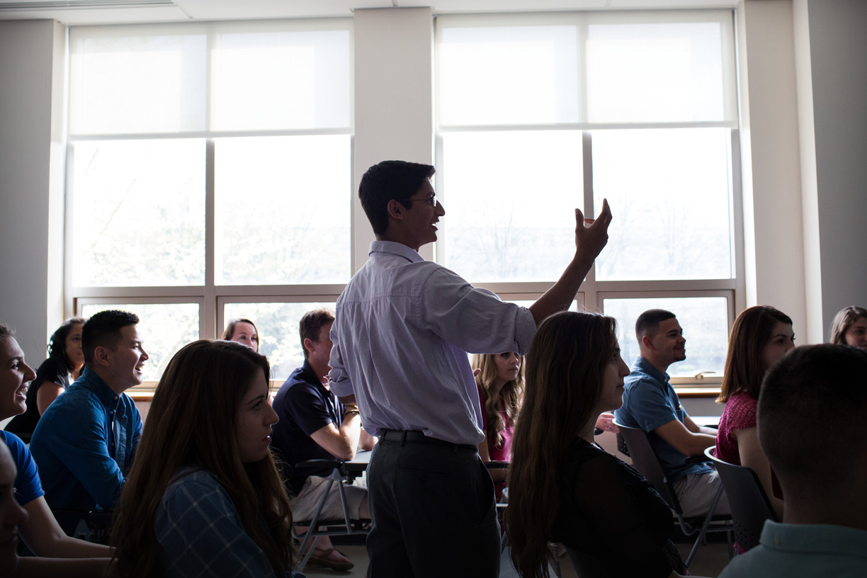 Students sitting in a classroom listening to a lecturer.