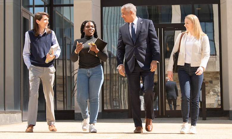 Students with the Dean outside the Law School.