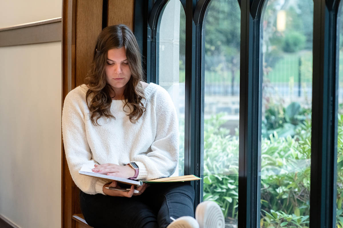 Female student reading a book
